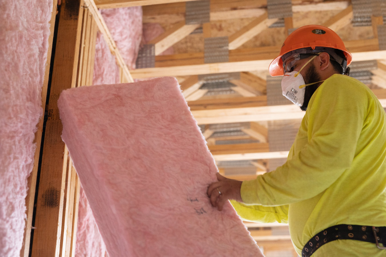 Insulation Contractor working on attic insulation in Denison, TX